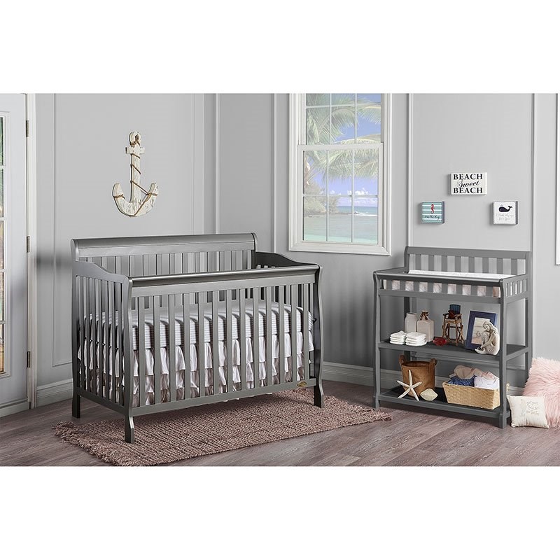 gray crib and changing table
